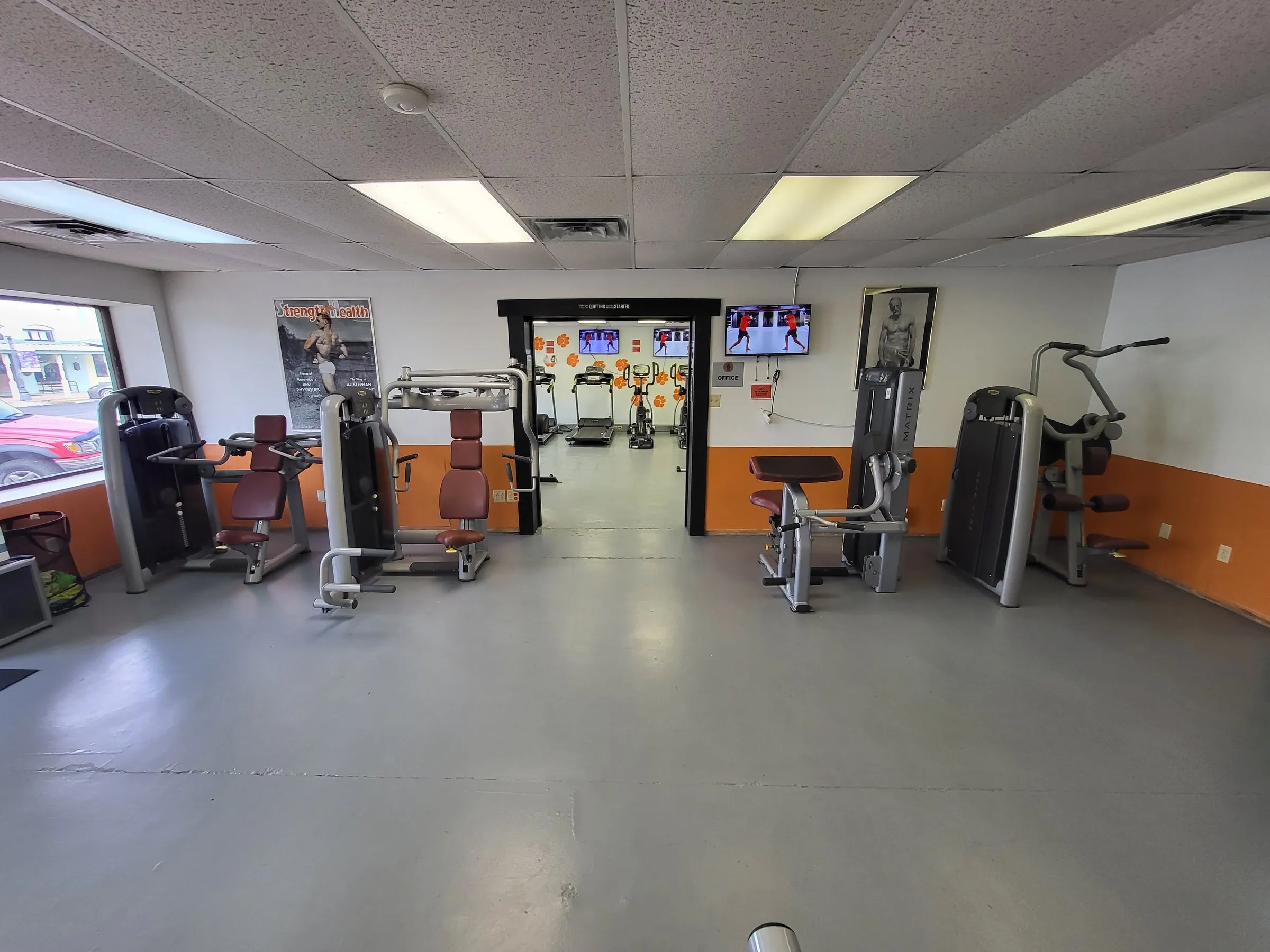 Looking down the strength machine floor toward the cardio room